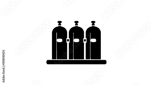 Three black cylindrical alkaline batteries on a flat surface side by side with caps and labels