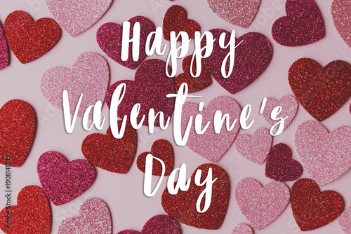 Happy valentines day greeting card. Happy Valentine's day text and stylish pink and red hearts flat lay on pink paper background, love banner