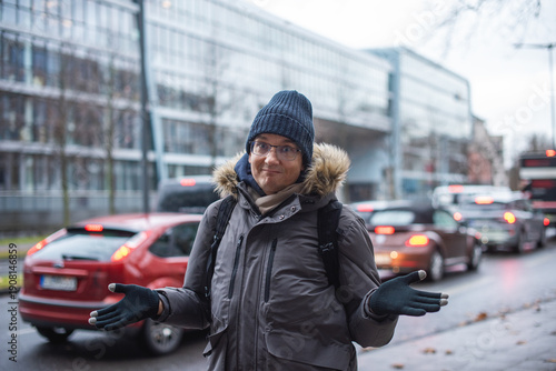 Close up. Vertical portrait of a male tourist using a smartphone.