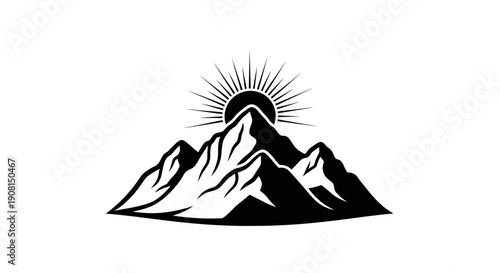 Mountain silhouette with radiant sun