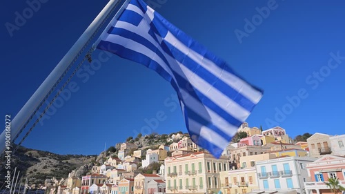 Greek Flag Over the Town of Symi, Greece