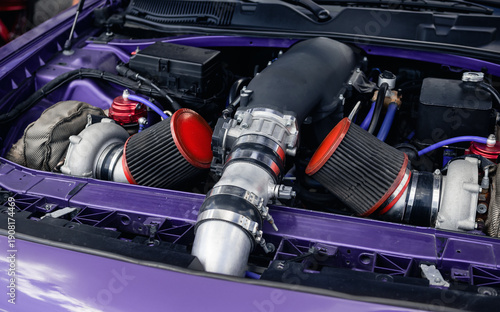Tableau sur toile Close-up of supercharged engine in purple car