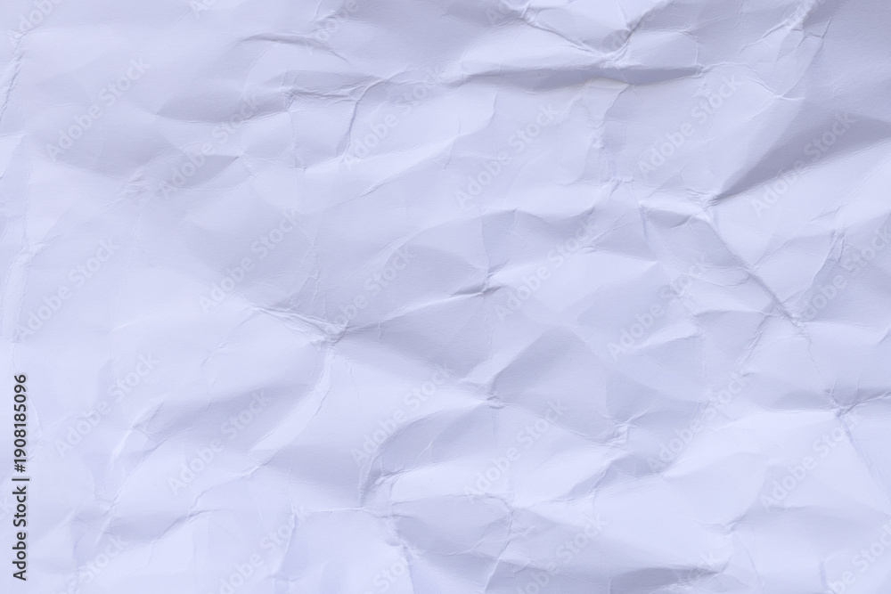 Obraz premium Crumpled White Paper Texture Background,Macro,Close-up top view of a heavily crumpled and wrinkled white paper sheet texture. This abstract background features various folds, creases, and shadows, 