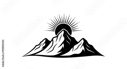 Mountain range silhouette with rising sun