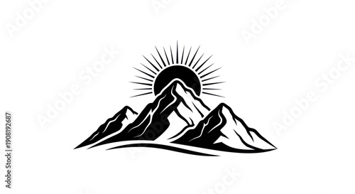 Mountain range silhouette with rising sun