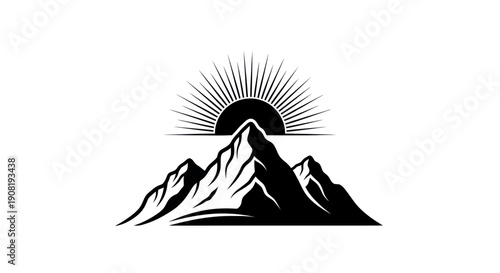 Mountain range silhouette with rising sun