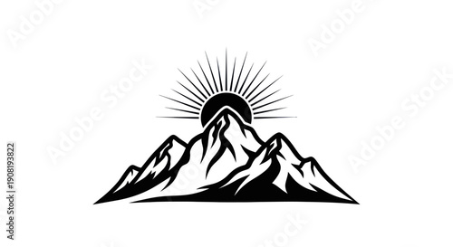 Mountain range silhouette with rising sun