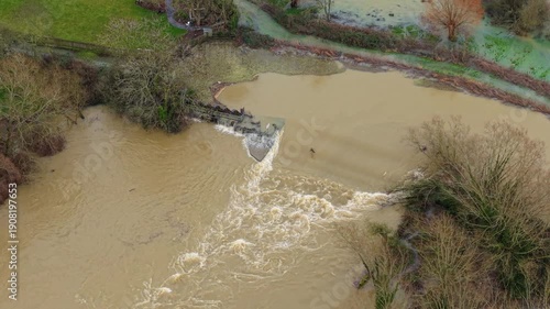 Cinematic 4K drone footage of extensive floodwaters covering the Soar Valley landscape in Leicestershire England during a major winter storm surge.