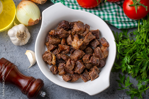 Obraz na plátně Muslims Traditional Sacrifice holiday food lamb, Turkish roasted meat in copper pot on table top