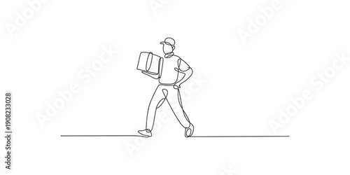 A person carrying a large box while walking forward in a casual stride