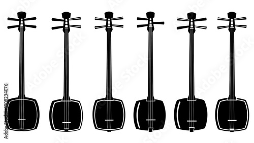 Multiple Japanese Shamisen String Instruments Lined Up Isolated on White Background