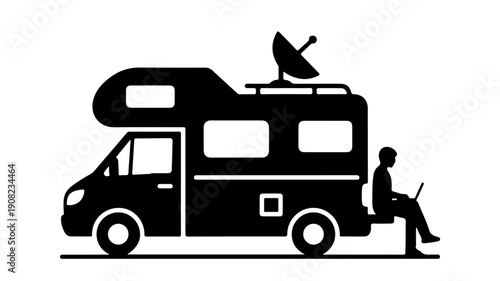 Mobile office RV with satellite dish and person working on laptop.