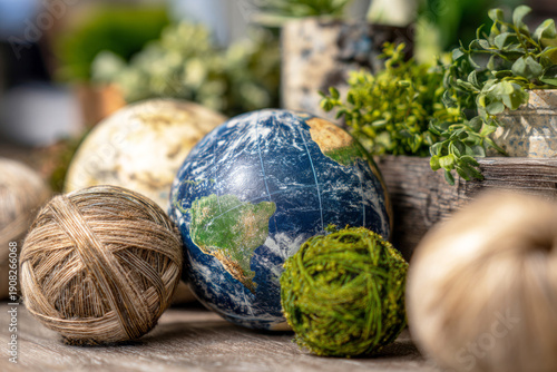 Decorations for Earth Day include globes representing the planet, greenery in pots, and materials made from recycled products. These props show support for environmental awareness