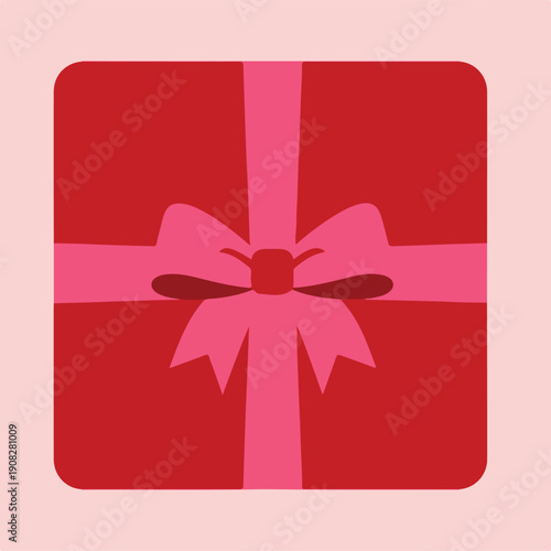 A beautifully wrapped red gift box with a pink bow, perfect for celebrating special occasions like Valentine's Day or birthdays