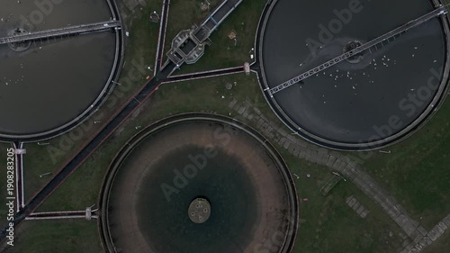 Aerial view of wastewater treatment plant circular tanks sustainability concept