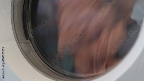 Wallpaper Mural Clothes dryer machine tumbling laundry creating a rhythmic thumping and continuous motor hum sound Torontodigital.ca