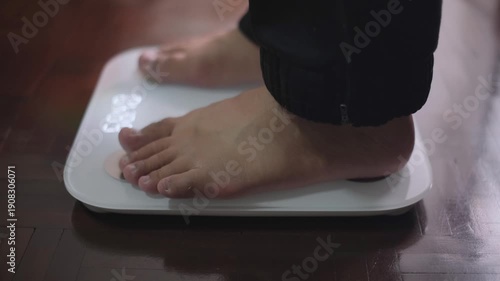 Wallpaper Mural Feet stepping onto a weighing scale and stepping off creating a heavy thumping and creaking sound Torontodigital.ca