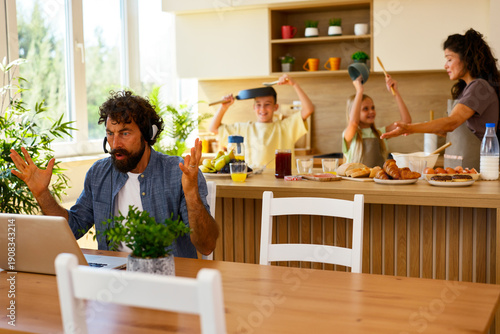 Bild auf Leinwand Working from home interrupted by noisy family in kitchen