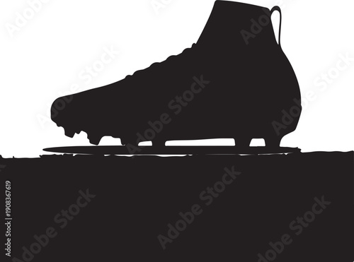 A silhouette of a soccer cleat on a flat surface, showcasing its design and structure.