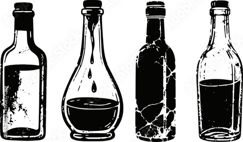 Four vintage glass bottles with varying shapes and different liquid levels isolated on white background