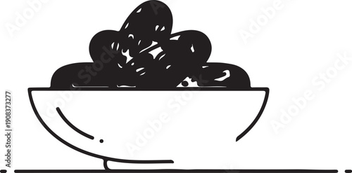 A white bowl filled with a cluster of black grapes sitting on a table.