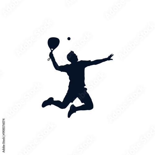 Silhouette of a man jumping and hitting a tennis ball with a racket