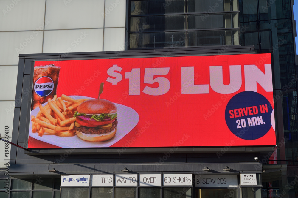 Fototapeta premium electronic billboard of a fast food restaurant on the exterior of Yonge Eglinton Centre (Eglinton Av W), Toronto