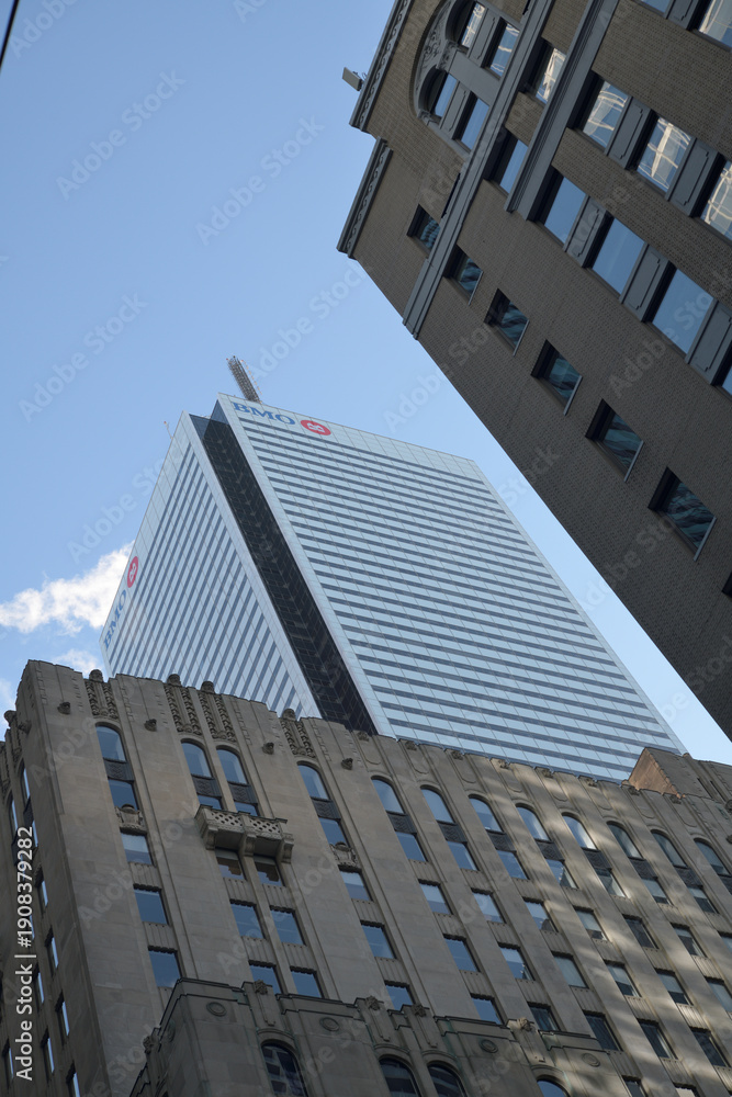 Fototapeta premium contrast of historic and modern office towers in Toronto Financial District