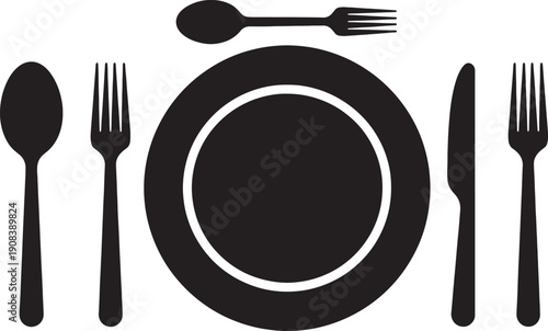 black dining table setting with plate and cutlery