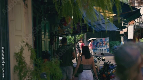 Wallpaper Mural Handheld shot of people walking through a busy and narrow alley in a traditional neighborhood of Bangkok, Thailand Torontodigital.ca