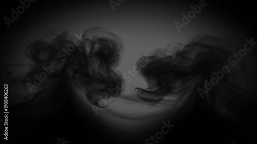 Dark smoky forms floating in a mostly black space, suitable for spooky, mysterious, and abstract design backgrounds and concepts.