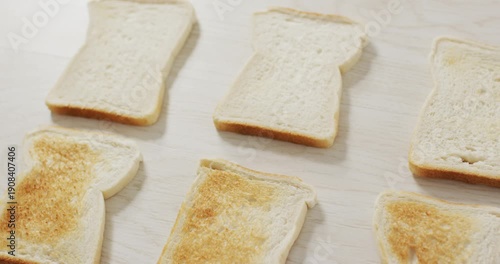 Video of differently baked toasts seeing from above on wooden worktop