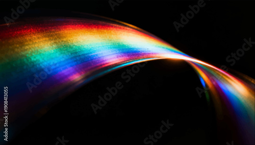 Vector illustration of a smooth stream of light that shimmers with all the colors of the rainbow on a black background.