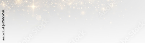 Sparkling bokeh with glowing stardust and magical particles, golden flare and shiny confetti across a bright abstract christmas background.
