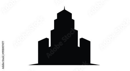 A stark silhouette of a tall tiered building with a pointed spire
