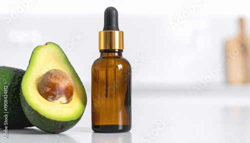 Avocado Oil Bottle with Fresh Avocados in Clean Bright Healthy Lifestyle Kitchen Setting