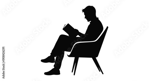 A man is peacefully seated in a chair intently reading a book presented as a striking silhouette