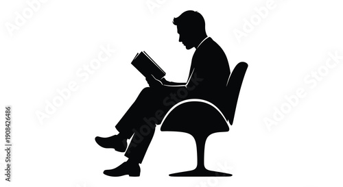 A solitary figure is deeply engrossed in reading a book while seated in a modern chair silhouette