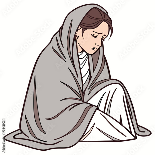 Woman wrapped in gray blanket sitting with head down