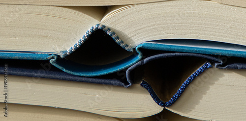 old books are laying on a table