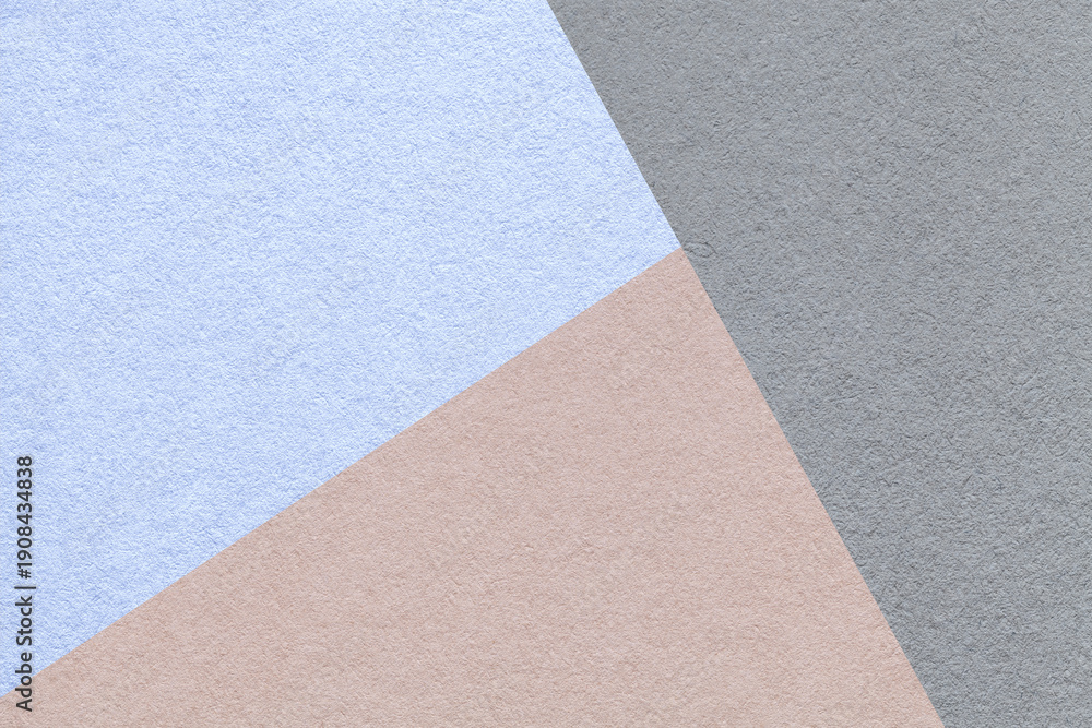 Fototapeta premium Geometric triangular light blue beige gray textured paper background with copy space for banner template