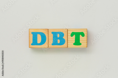 DBT an abbreviation crafted from wood