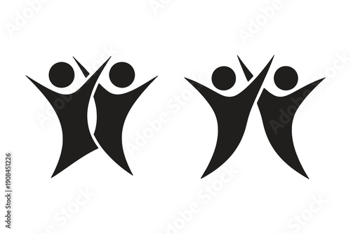 Two happy people jumping with arms outstretched in celebration or joy