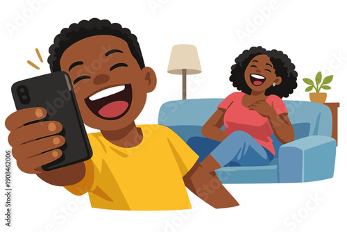 A happy, laughing African American boy inadvertently snaps a selfie while hanging out at home with his mother