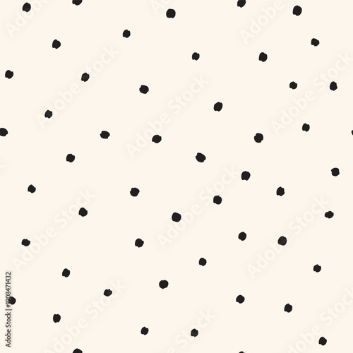 Tossed small black dots on cream white Seamless Vector Pattern Hand Drawn polka dots background