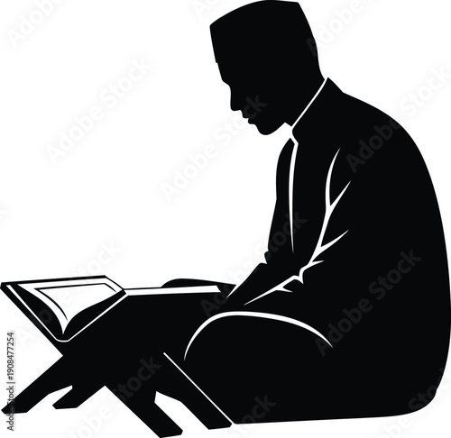 Young muslim man reading holy quran book on stand during ramadan silhouette
