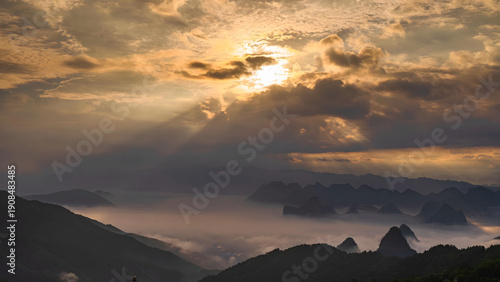 Obraz na plátně Guilin Mountains at Sunset with Dramatic Golden Light and Misty Valleys
