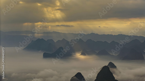 Obraz na plátně Guilin Mountains with Mist and Golden Sky at Sunrise