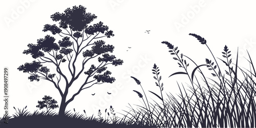 Silhouette of a tree and tall grass with birds flying in the background at sunset