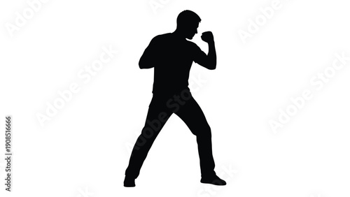 Silhouette of a boxer in a fighting stance preparing to strike a blow